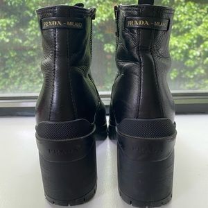 Prada booties with lug sole and zipper.